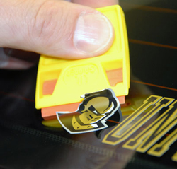 Use ScrapeRite Plastic Razor Blades to safely remove stickers from auto paint.
